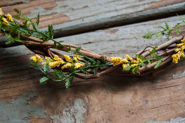 Thin Grapevine Wreath With Yellow Flowers